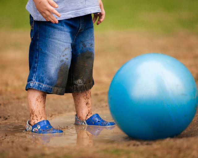 young%20child%20having%20fun%20and%20getting%20muddy young%20child%20having%20fun%20and%20getting%20muddy